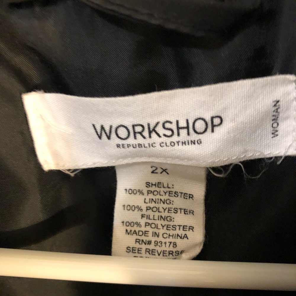 Women’s black puffer vest .